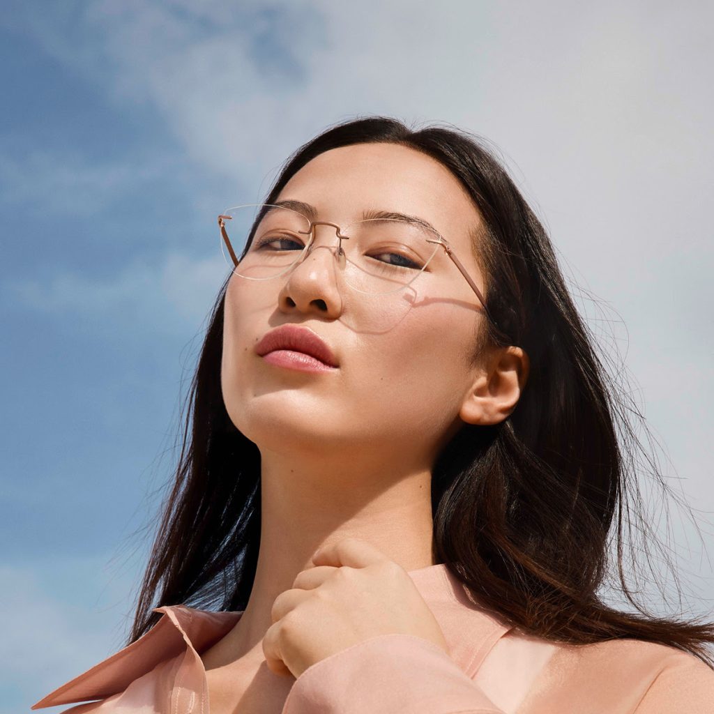 Woman wearing Silhouette rimless glasses outdoors